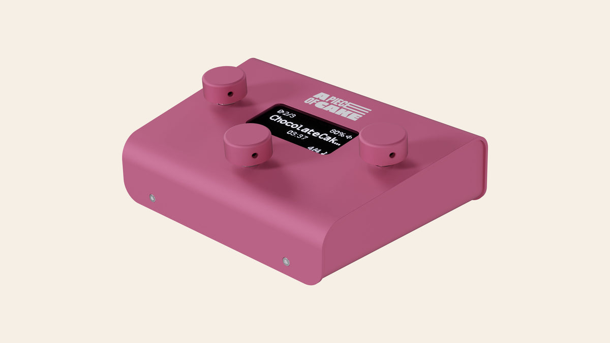 A piece of cake backing track player in pink, angled view