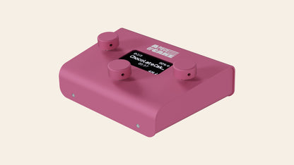 A piece of cake backing track player in pink, angled view